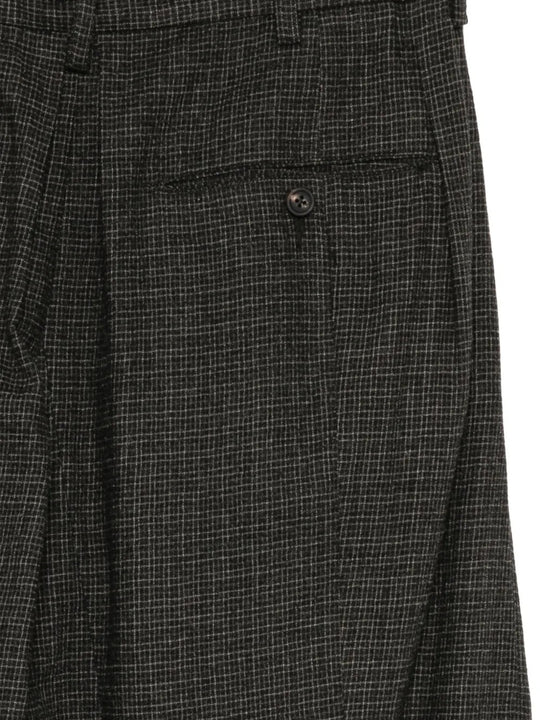 Close up of Grey pants, showing texture of the 100% wool fabric