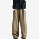 Navy pants worn by a person, showing the pants' fit