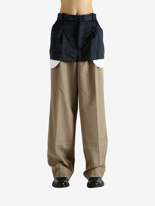 Navy pants worn by a person, showing the pants' fit