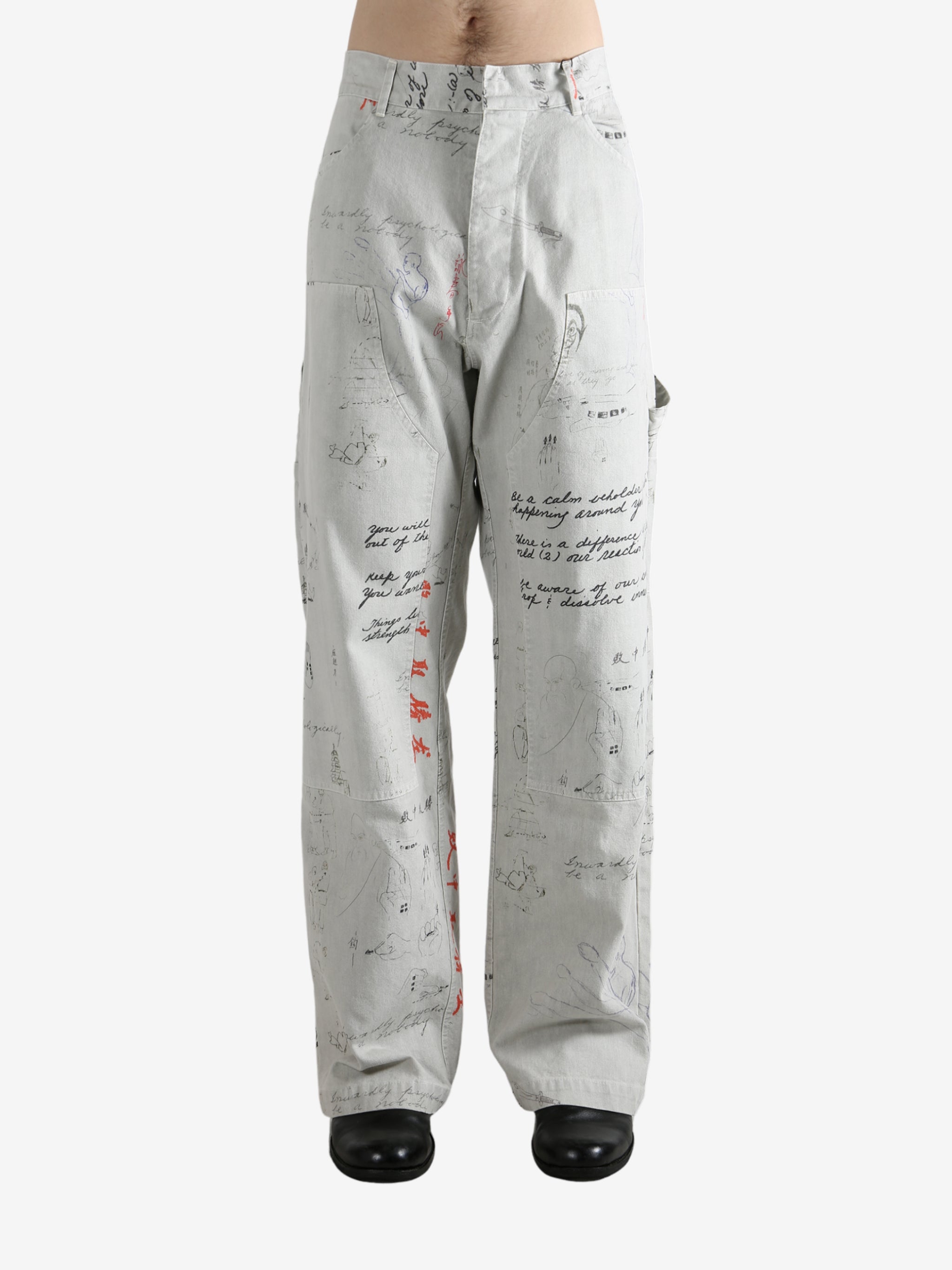 Grey pant worn by a person, showing the pant's fit