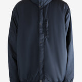 Navy jacket worn by a person, showing the jacket's fit