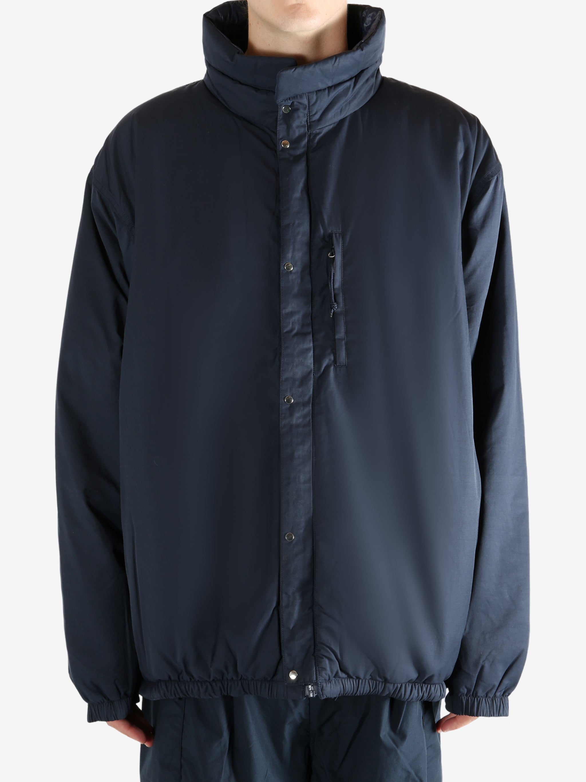 Navy jacket worn by a person, showing the jacket's fit