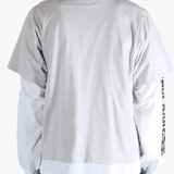 White shirt worn by a person, showing the shirt's fit