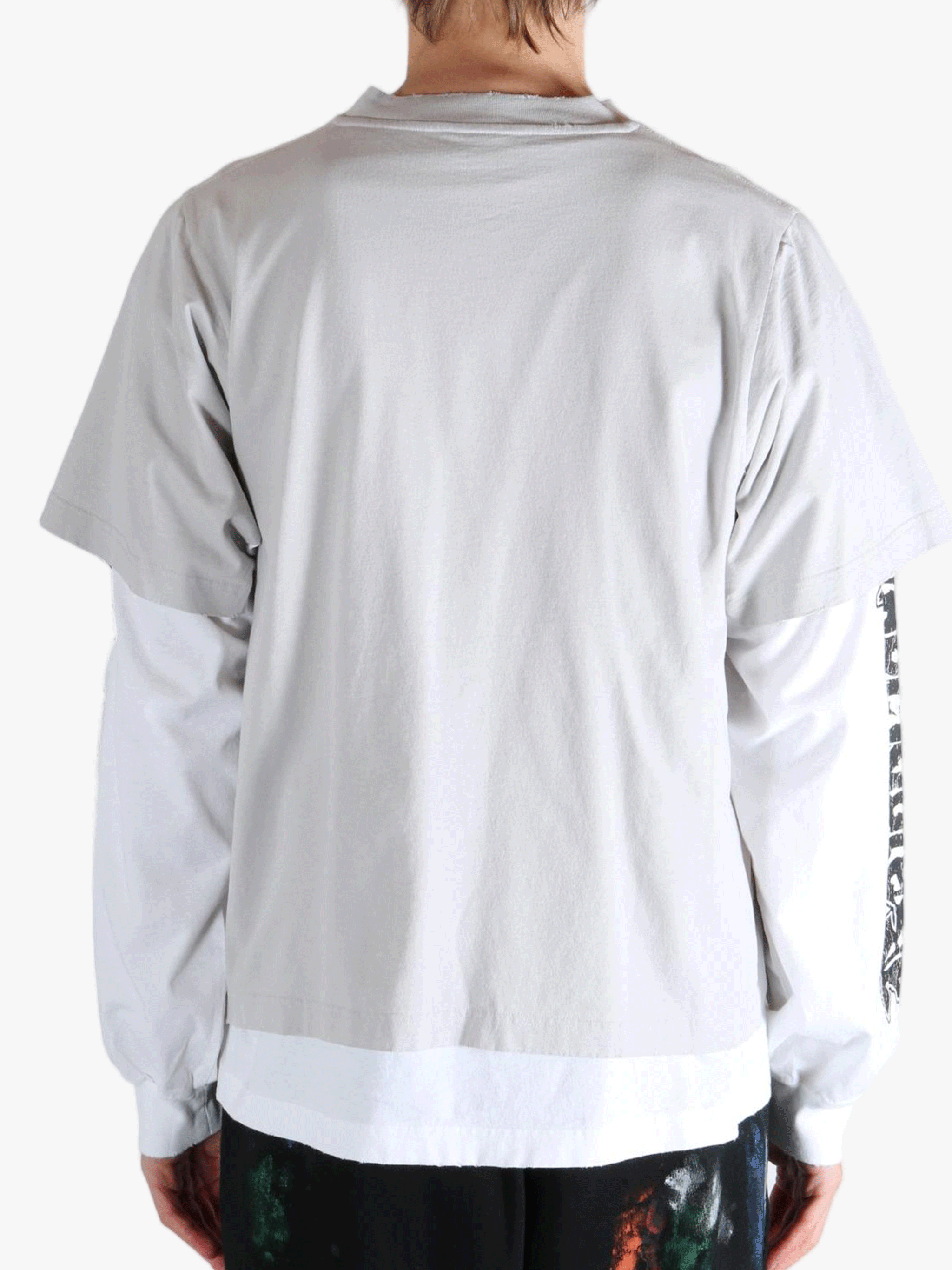 White shirt worn by a person, showing the shirt's fit