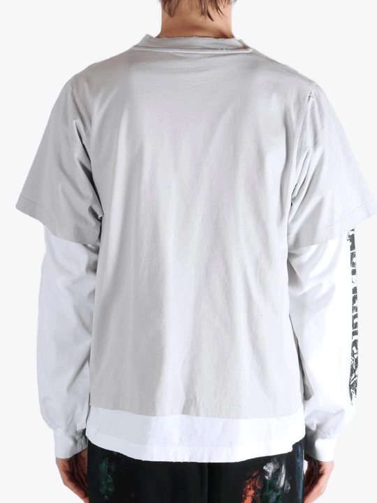 White shirt worn by a person, showing the shirt's fit