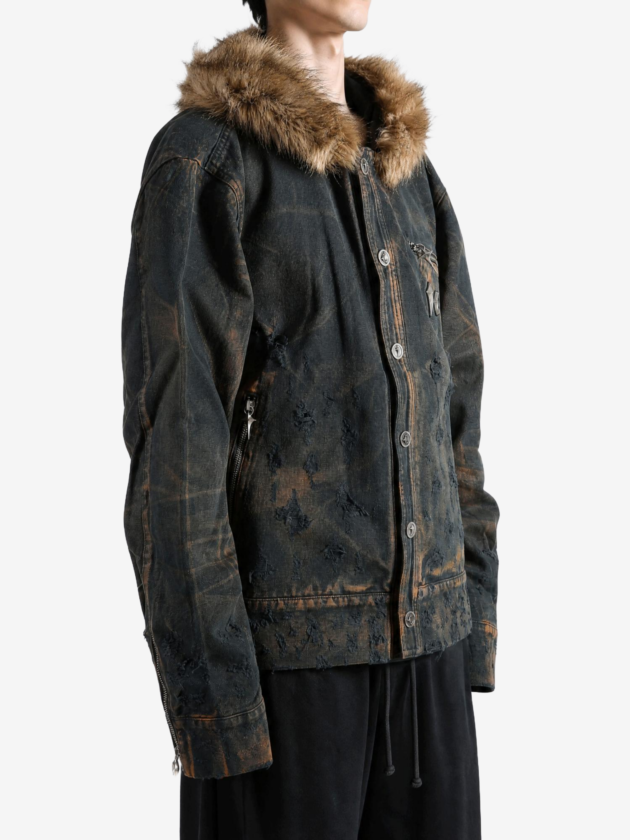 Black jacket worn by a person, showing the jacket fit