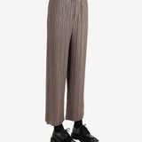 Brown pants worn by a person, showing the pants' fit