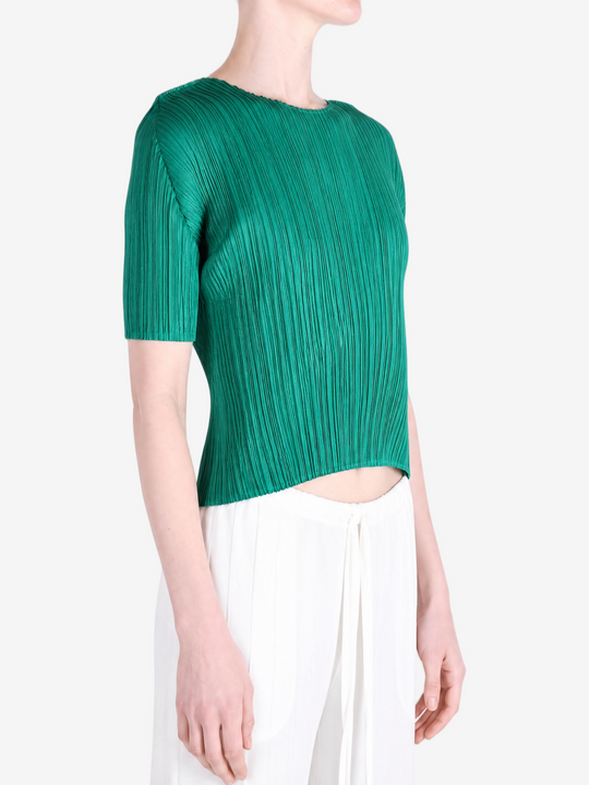 Green shirt worn by a person, showing the shirt fit