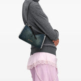 Blue bag worn by a person, showing the bag fit