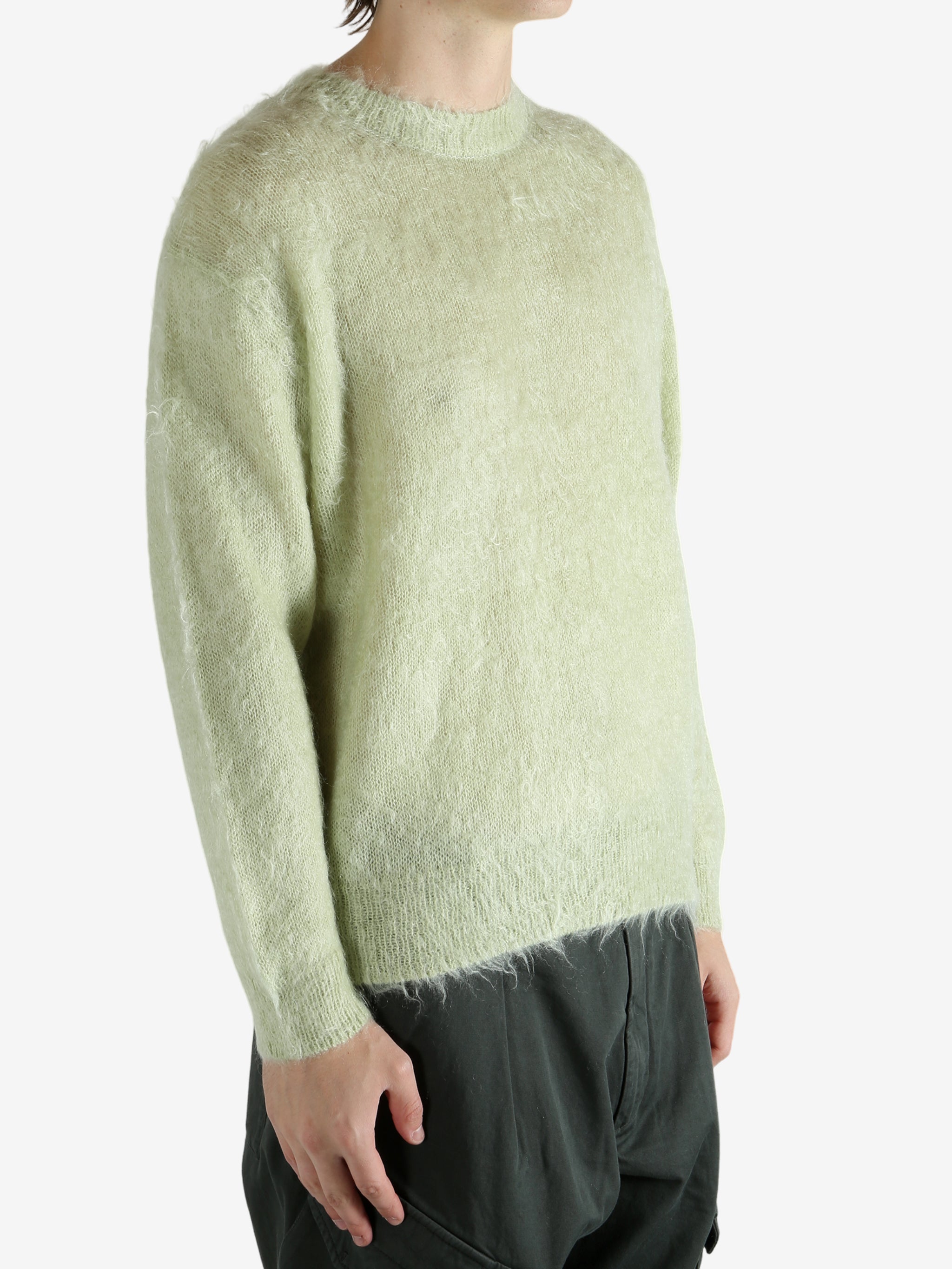 Tan sweater worn by a person, showing the sweater's fit