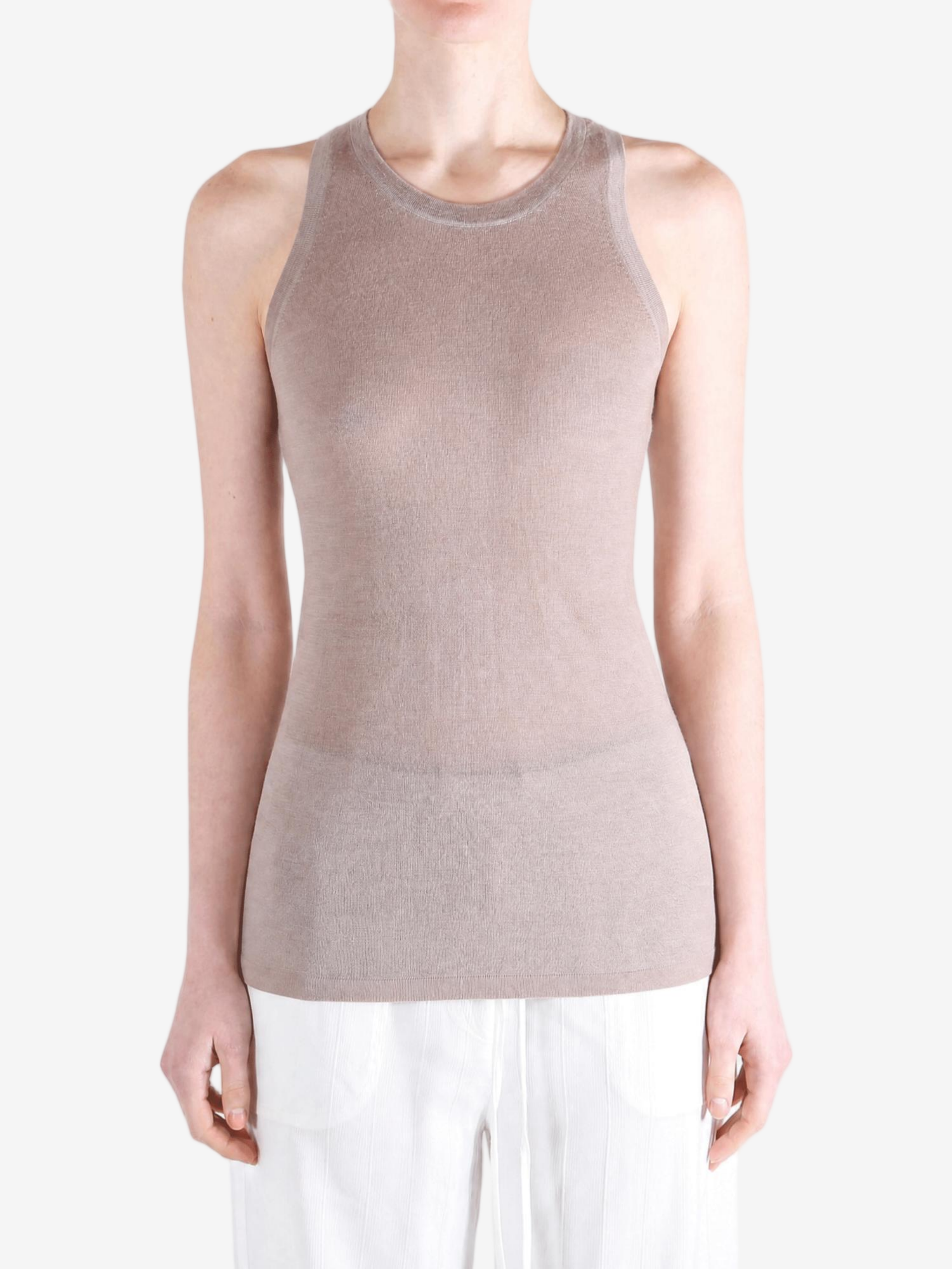 Tan top worn by a person, showing the top fit