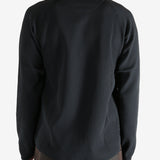 Black shirts worn by a person, showing the shirts fit