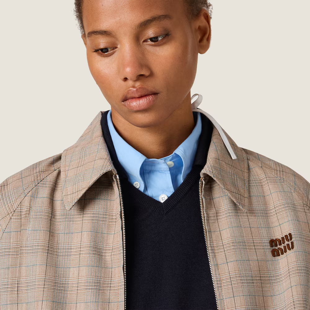 Tan jacket worn by a person, showing the jacket fit