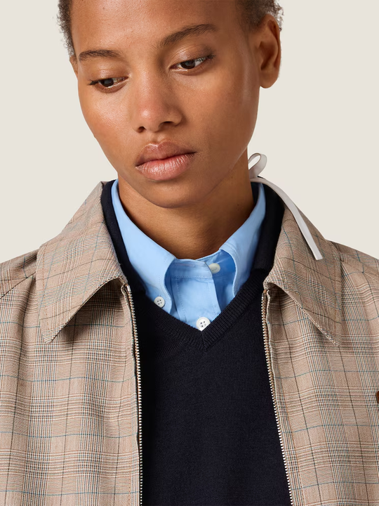 Tan jacket worn by a person, showing the jacket fit