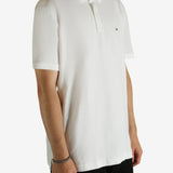 White shirt worn by a person, showing the shirt fit