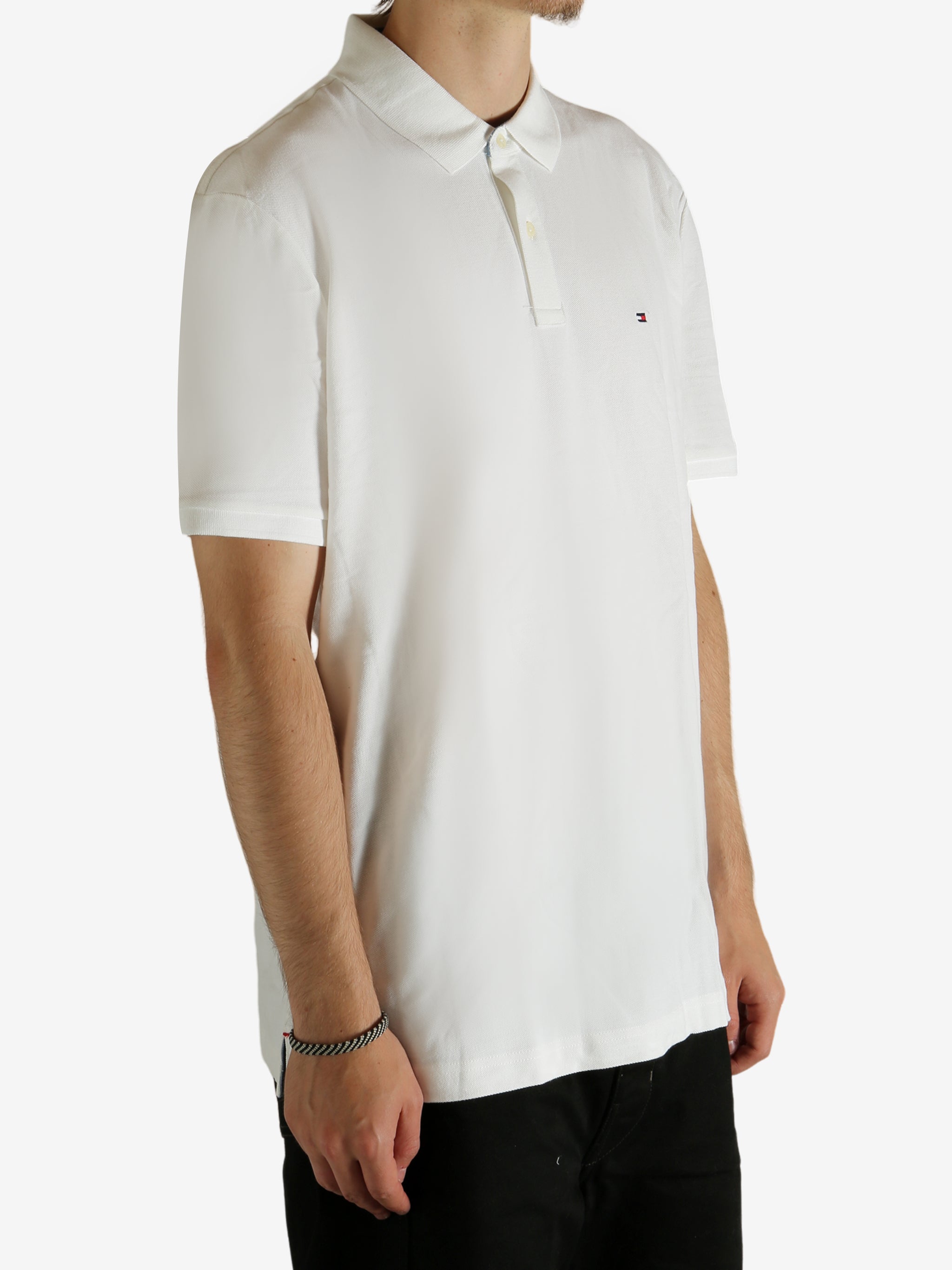 White shirt worn by a person, showing the shirt fit