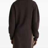 Brown sweater worn by a person, showing the sweater's fit