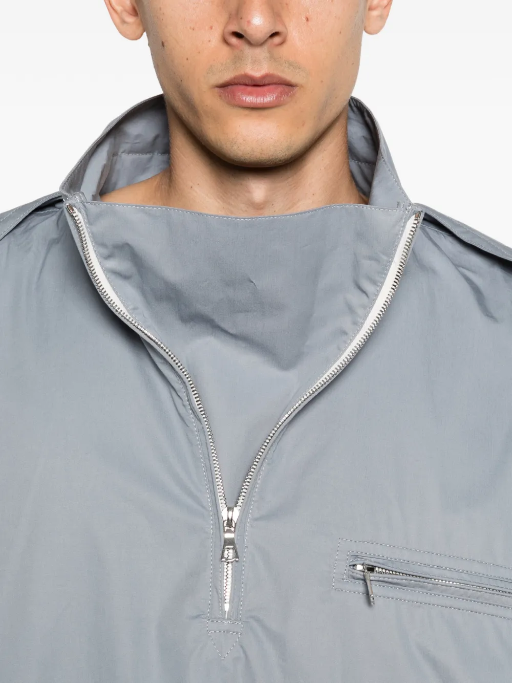 Close up of grey windbreaker, showing texture of the Cotton fabric
