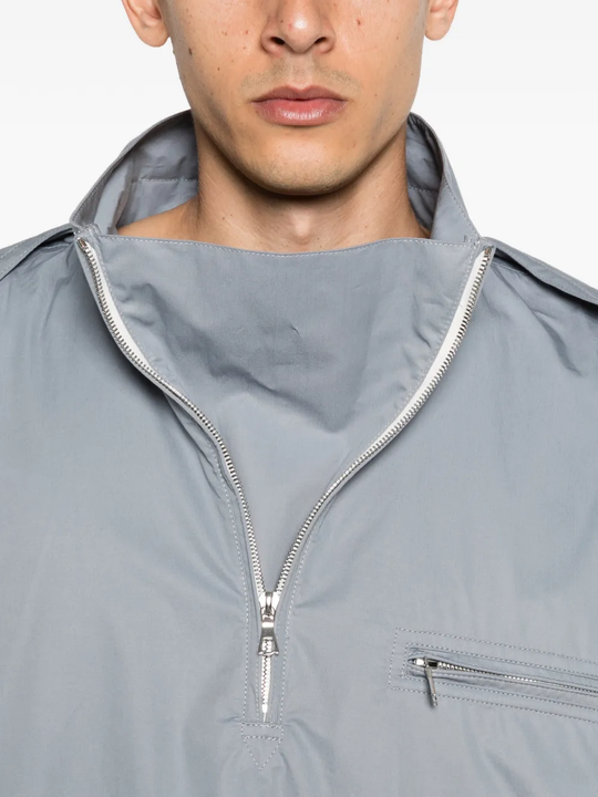 Close up of grey windbreaker, showing texture of the Cotton fabric