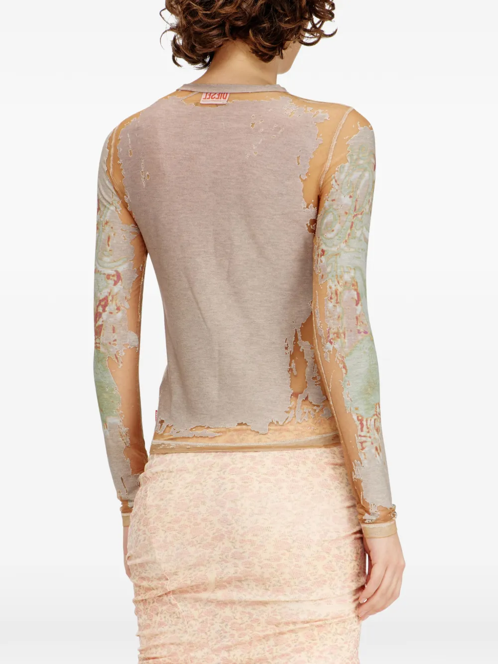 Tan top worn by a person, showing the top fit