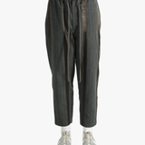 Grey pants worn by a person, showing the pants' fit