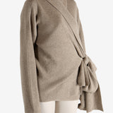 Tan cardigan worn by a person, showing the cardigan's fit