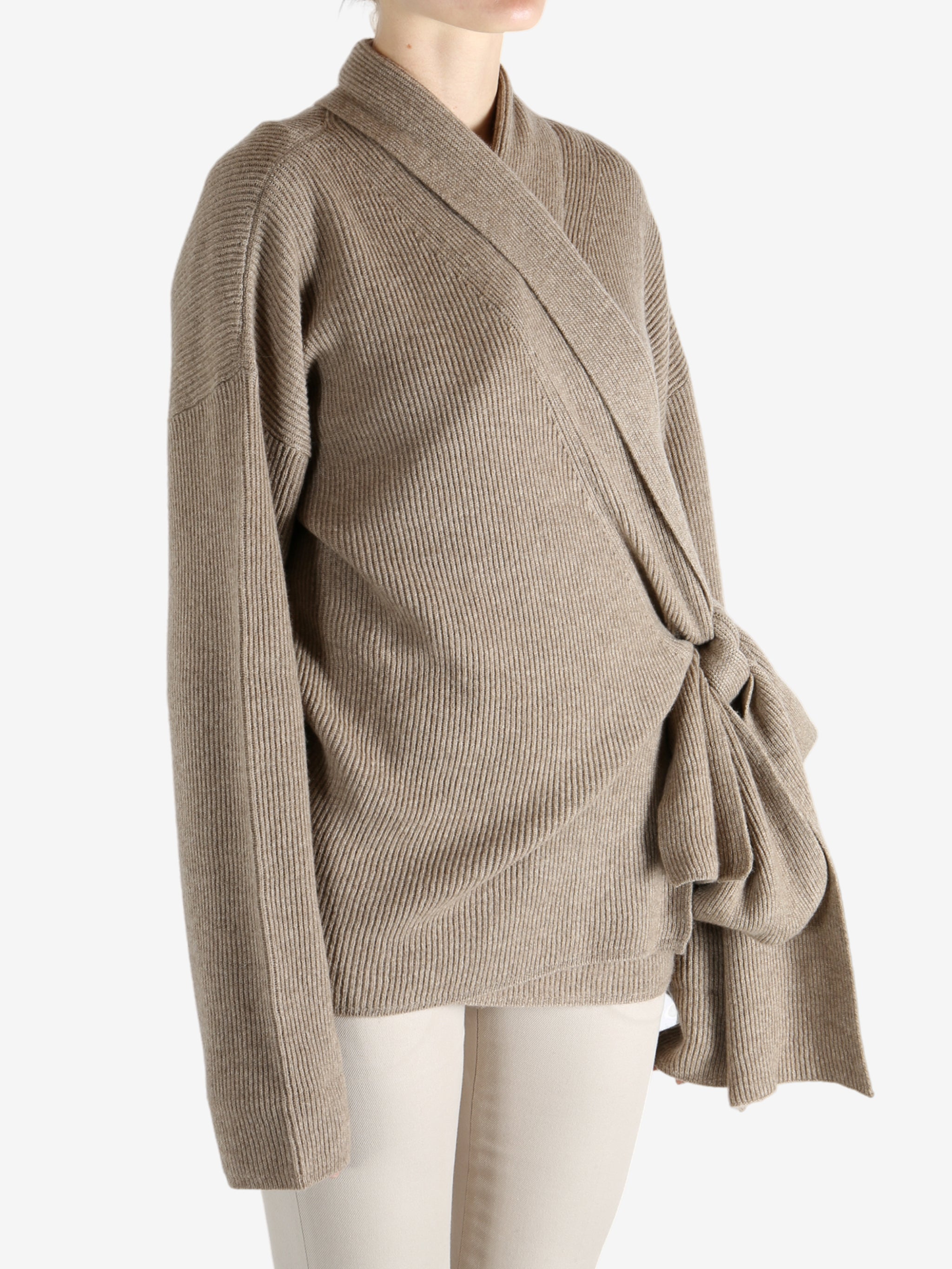 Tan cardigan worn by a person, showing the cardigan's fit