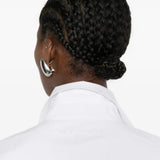 Cloes-up of white shirt, showing texture of the cotton fabric
