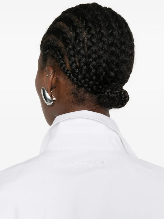 Cloes-up of white shirt, showing texture of the cotton fabric