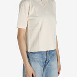 White shirt worn by a person, showing the shirt's fit