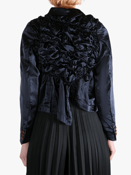 Navy jacket worn by a person, showing the jacket's fit