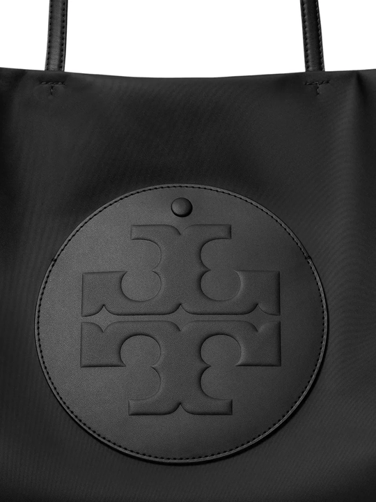 Close up of black tote bag,showing texture of the nylon fabric.
