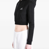 Black hoodie worn by a person, showing the hoodie's fit