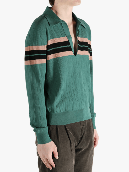 Green knitwear worn by a person, showing the knitwear's fit