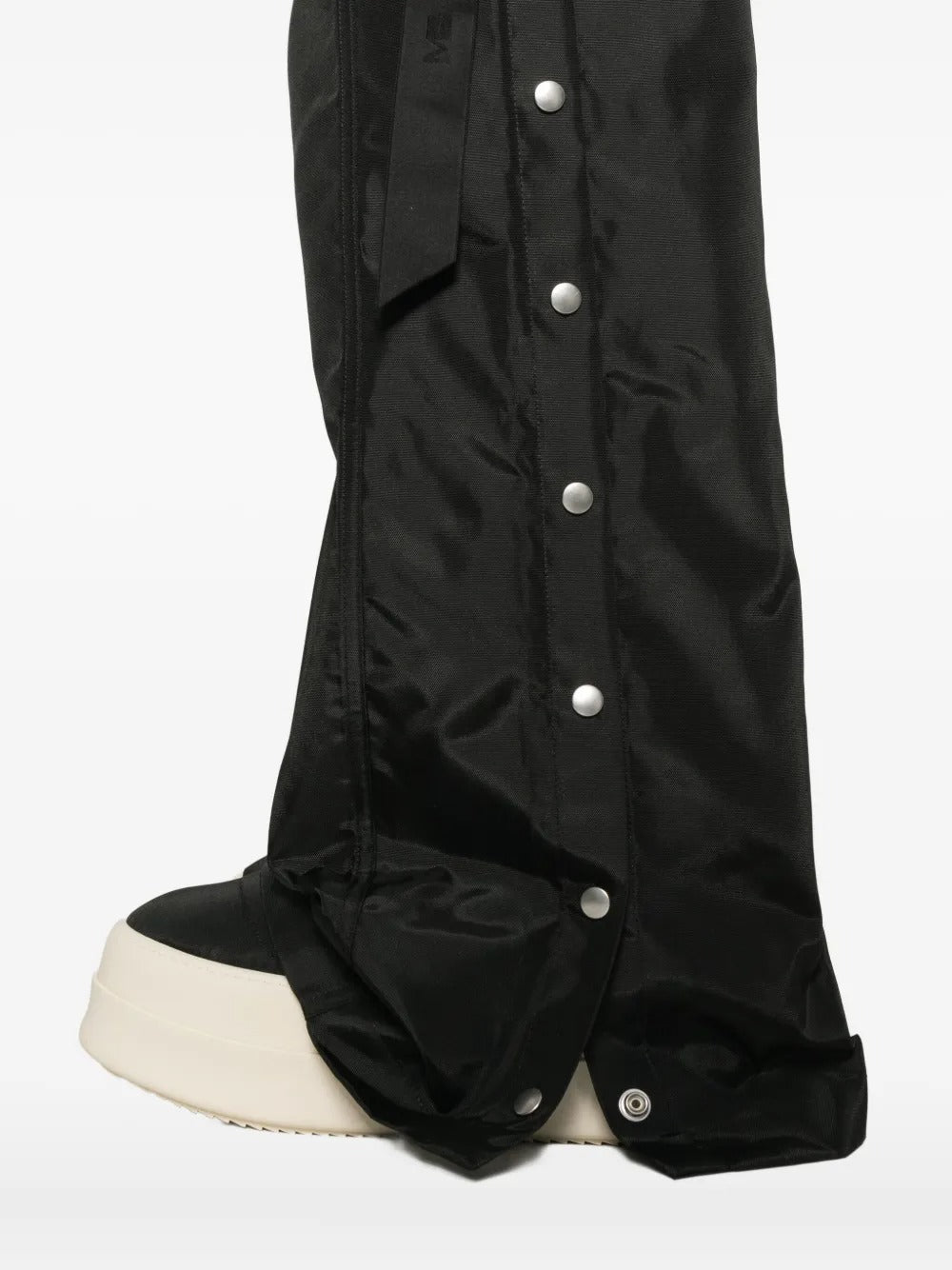 Close up of the black pants, showing texture of the nylon fabric