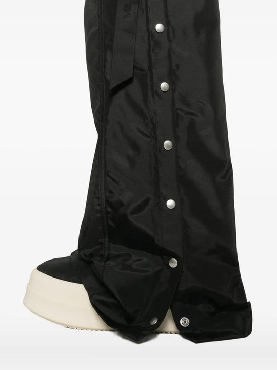 Close up of the black pants, showing texture of the nylon fabric