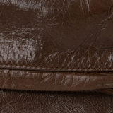 Close up of the brown bag, showing texture of the calfskin fabric