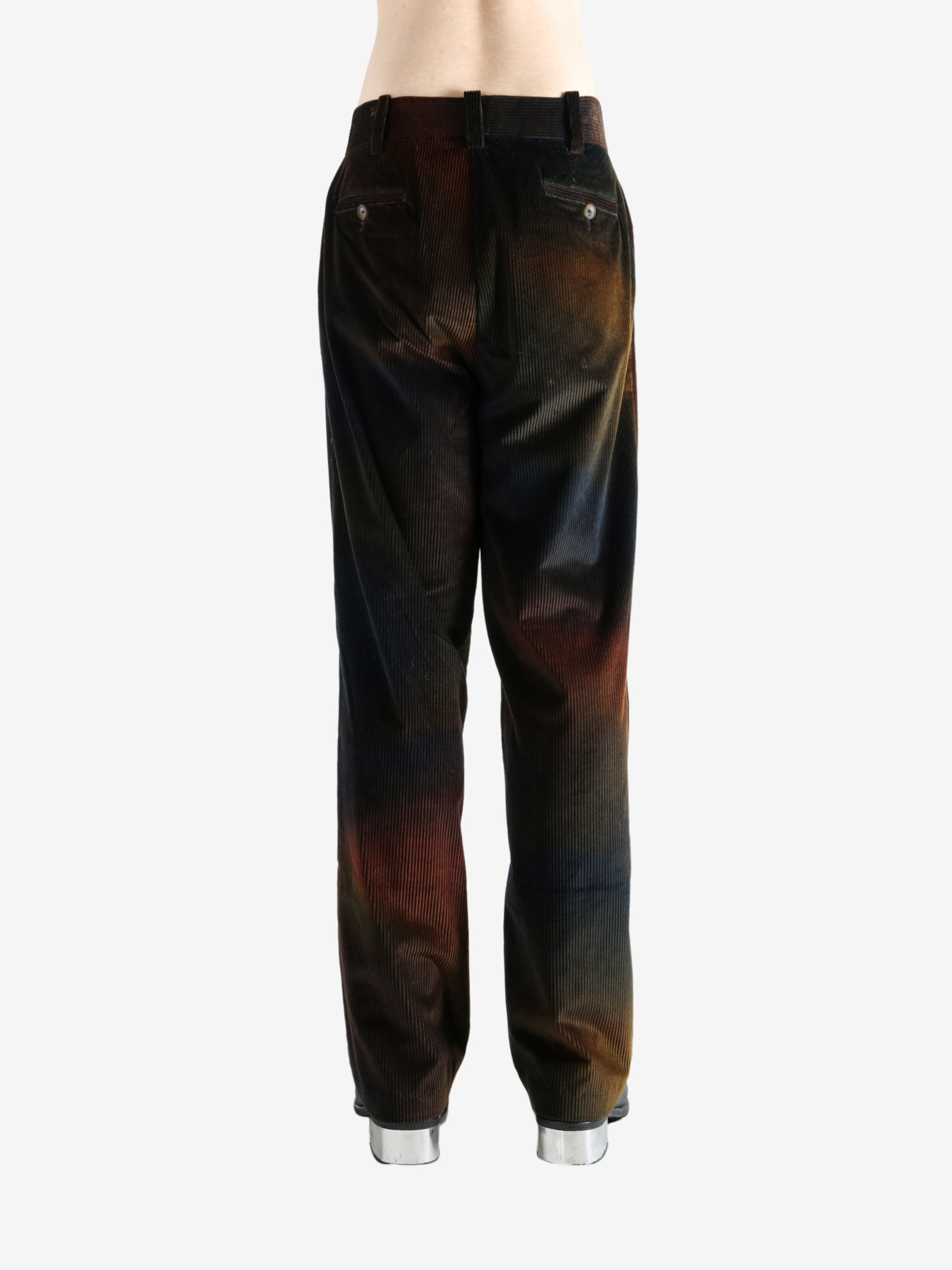 Black pants worn by a person, showing the pants's fit