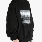 black t-shirts  worn by a person, showing the t-shirts fit