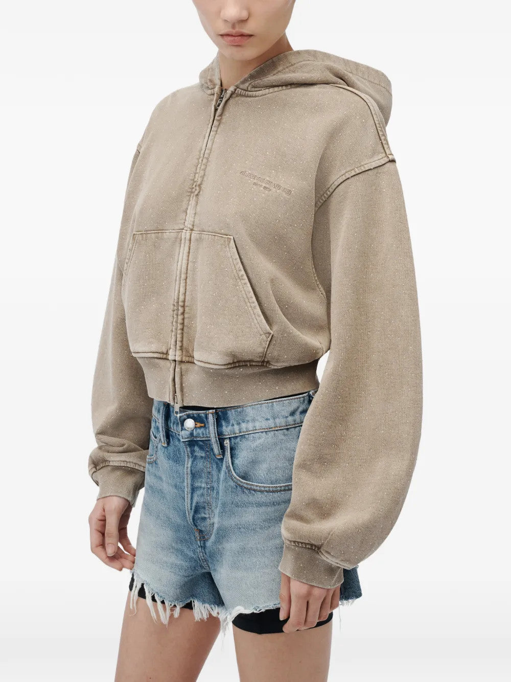 Tan hoodie worn by a person, showing the hoodie fit