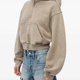 Tan hoodie worn by a person, showing the hoodie fit