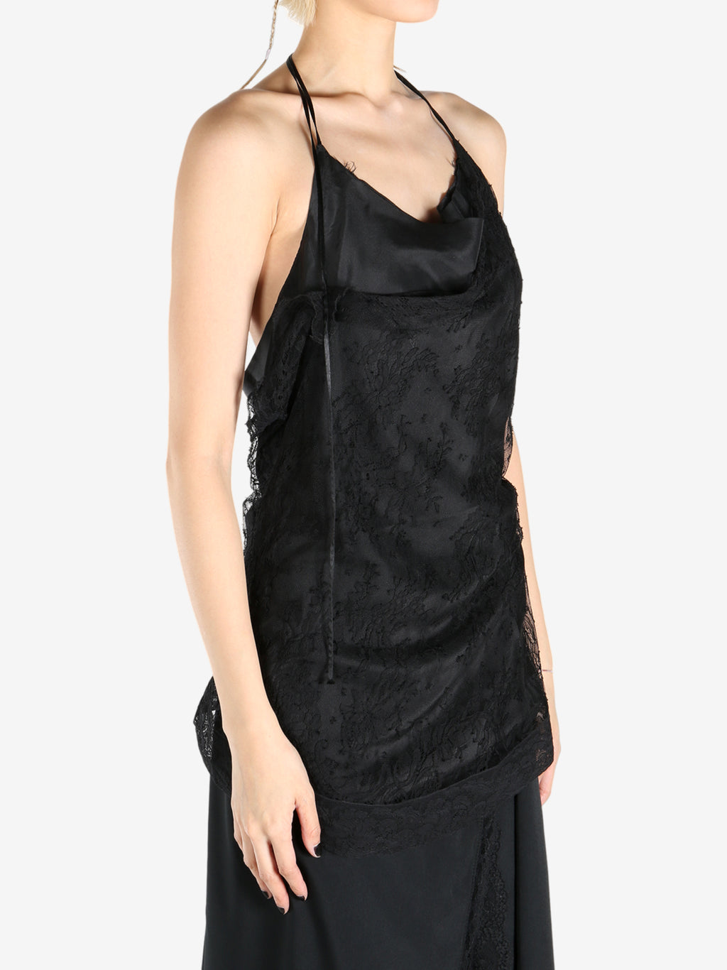 Black tops worn by a person, showing the tops fit