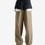 Navy pants worn by a person, showing the pants' fit