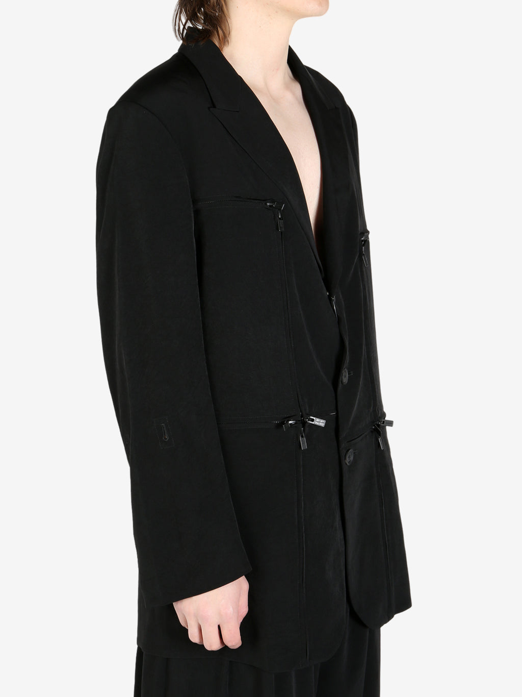 Black jacket worn by a person, showing the jacket's fit
