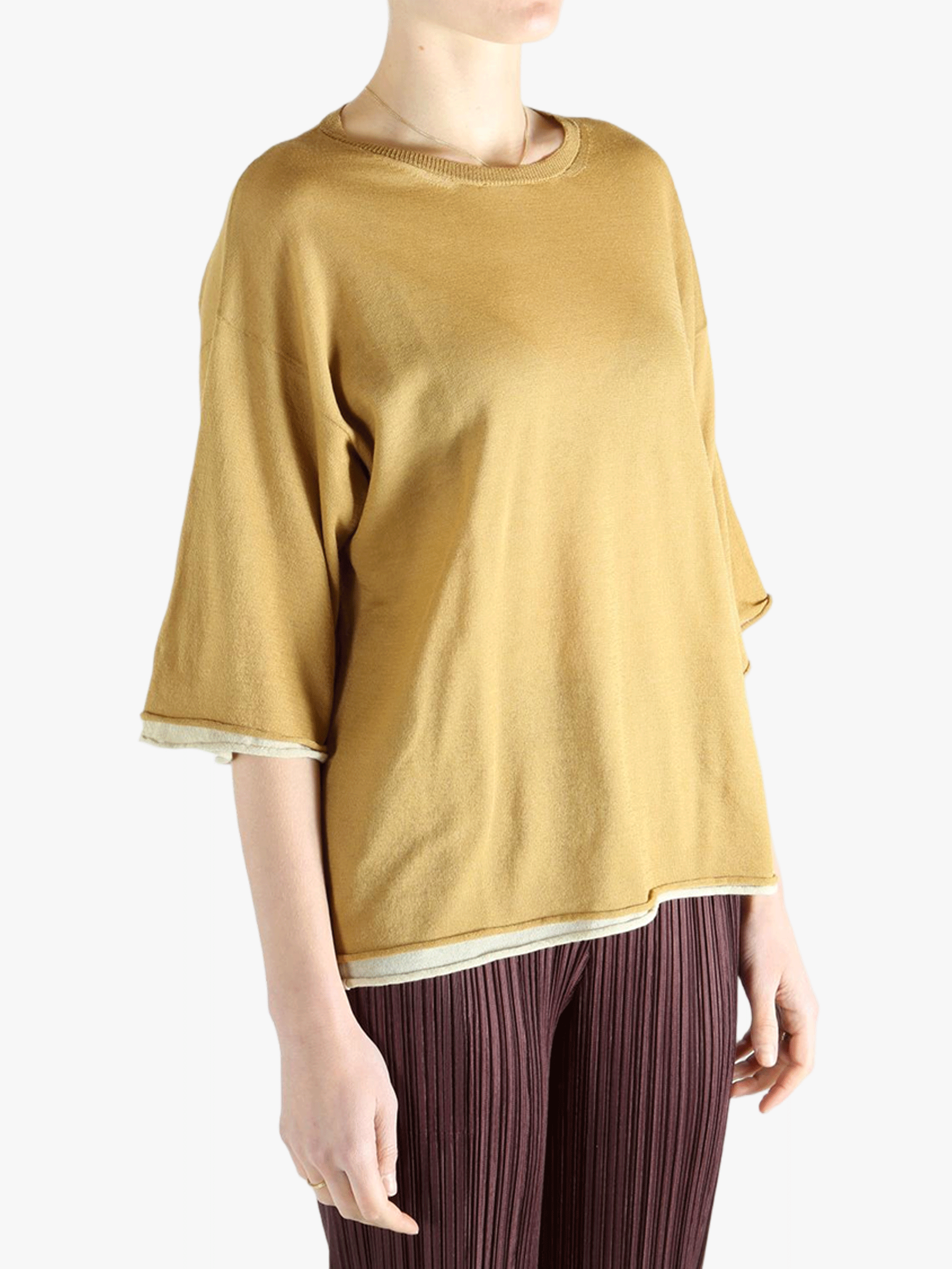 Yellow top worn by a person, showing the top fit