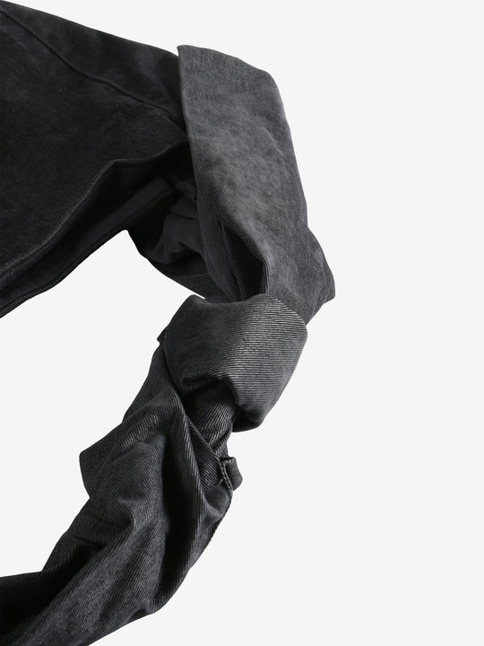 Close up of the black bag, showing texture of the cotton fabric