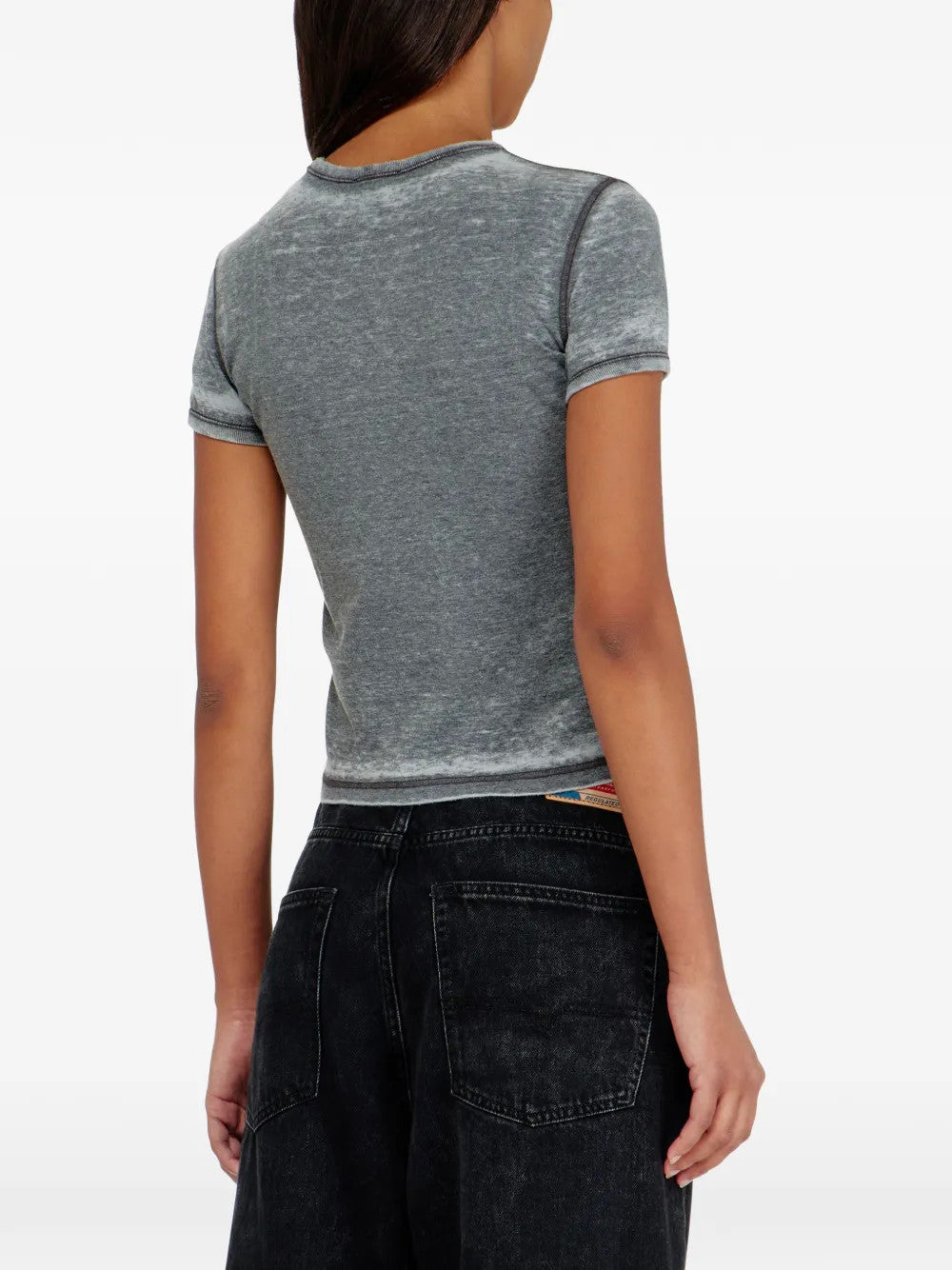 Grey t-shirt worn by a person, showing the t-shirt fit