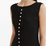 Black jacket worn by a person, showing the jacket fit