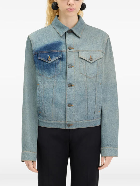 Blue jacket worn by a person, showing the jacket fit
