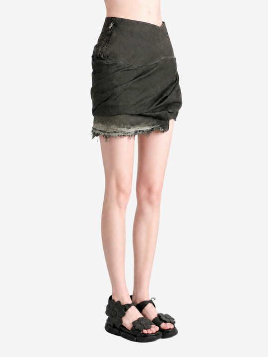 Green skirt worn by a person, showing the skirt fit